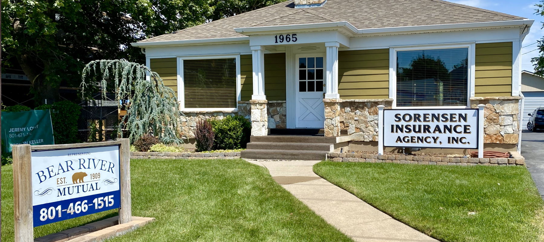 Family in front of new house